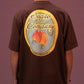 Camiseta oversized marrom com estampa colorida de caju e texto "Sopro Company" nas costas