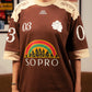 Camiseta Rolimã Racing Marrom com estampa arco iris e detalhes em bege da marca "SOPRO"