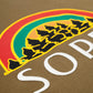 Camiseta Rolimã Racing Verde com estampa arco iris e detalhes em branco da marca "SOPRO"