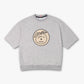 Camiseta cinza clara Crew Nuestra Tierra com estampa redonda frontal com desenho de folhas e texto Sopro Co produzido em terras brasileiras